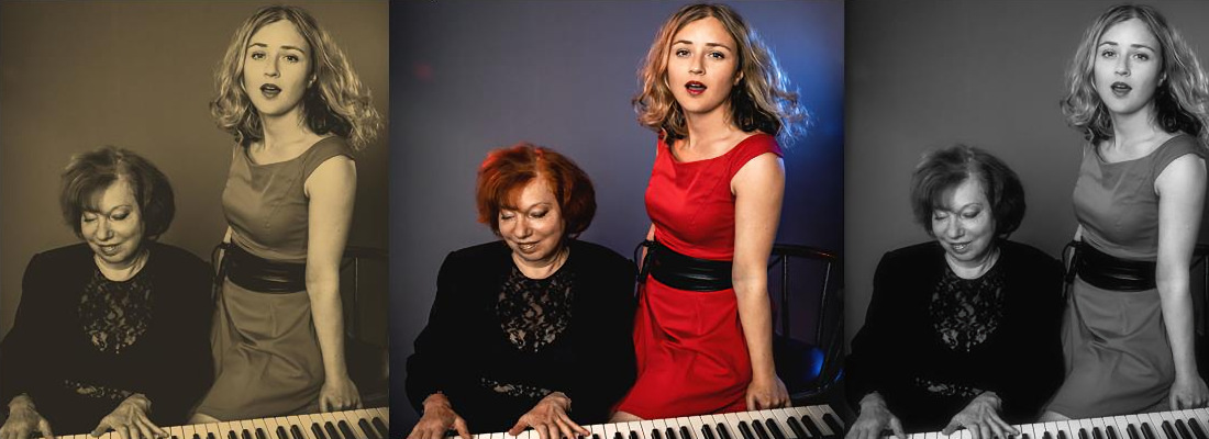 Links auf dem Bild sitzt  eine schwarz gekleidete Frau am Klavier, neben ihr steht die Sängerin im roten Kleid.