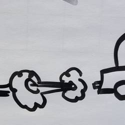 Auf einem Flipchart ist ein Auto in Bewegung gezeichnet.