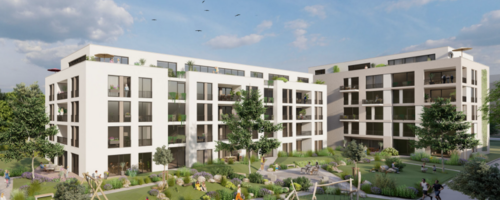 Ein Häuserensemle mit grünem Innenhof