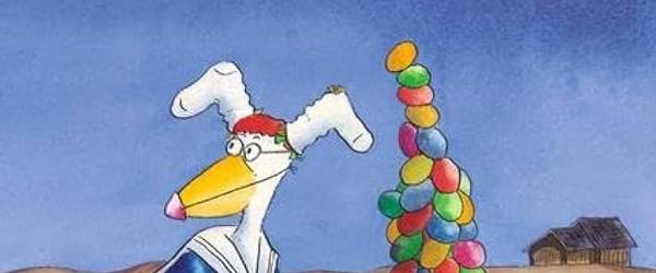 Ein Huhn mit Hasenohren schiebt einen riesigen Berg bunter Eier in einer Schubkarre